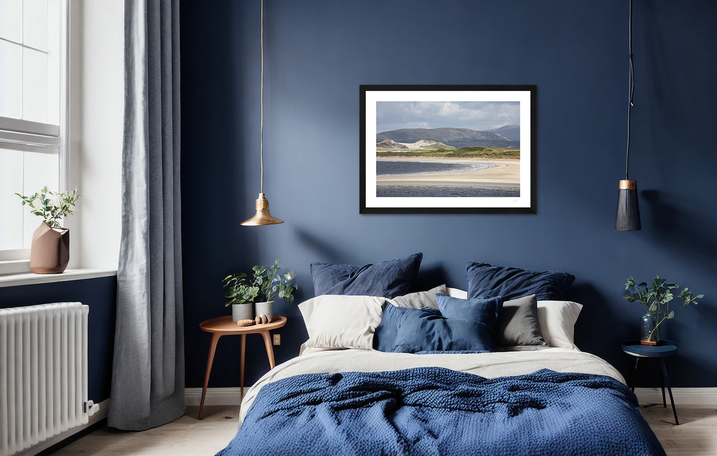 a framed fine art photographic print of Portnoo Strand in County Donegal hanging on a wall above a bed