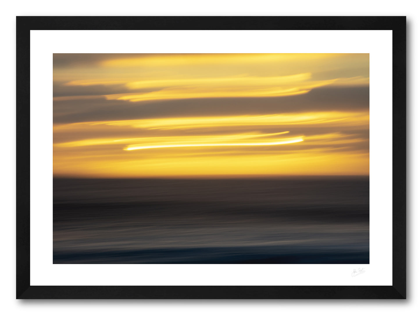 a framed fine art photograph using intentional camera movement of a sunset in el Golfo in Lanzarote