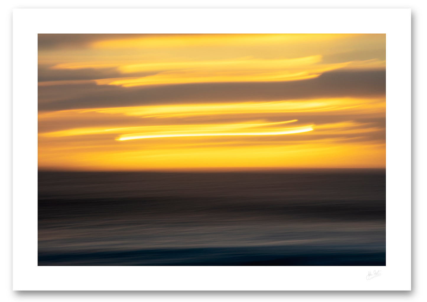 an unframed fine art photograph using intentional camera movement of a sunset in el Golfo in Lanzarote