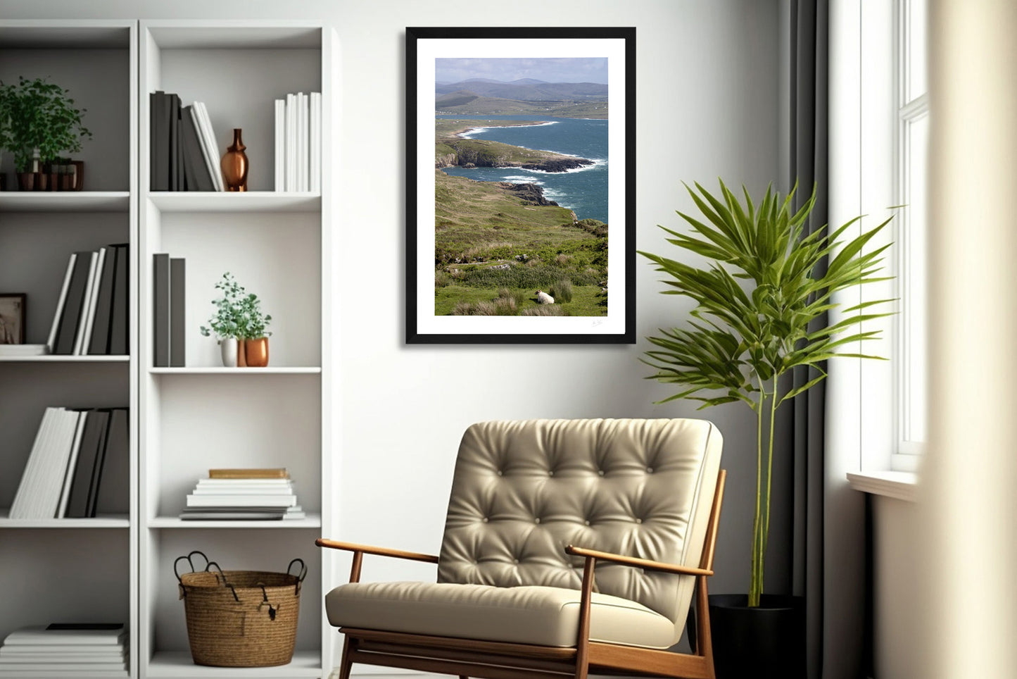 a framed fine art photography of the stunning view of the Crohy coastline and Donegal landscape from Crohy Head hanging on a white wall above a beige chair in a living room