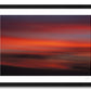 a framed intentional camera movement fine art photographic print of clouds in a red twilight sky above the island of Lanzarote, Canary Islands