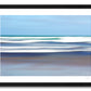 a framed fine art photograph using intentional camera movement of white waves off Famara Beach, on the island of Lanzarote in the Canary Islands providing a lovely contrast to the blue sea and sky. 