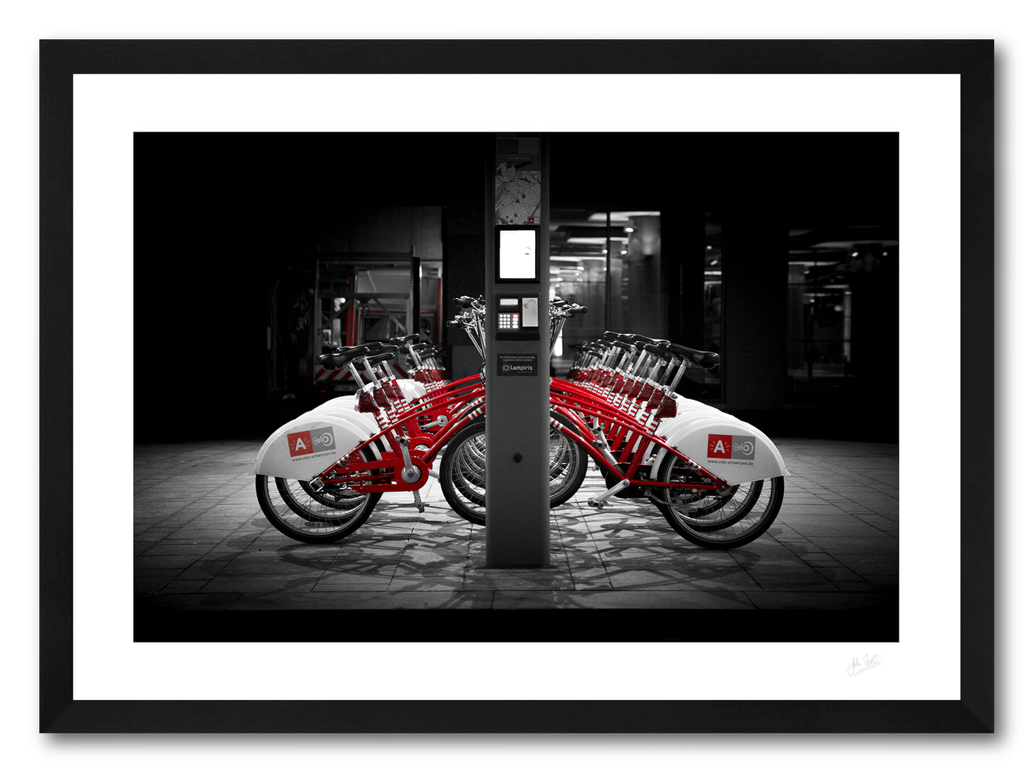 a framed fine art photographic print of rental bikes on a bike rack outside Antwerp Central Train Station, available to buy online