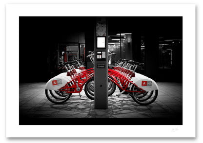 an unframed fine art photographic print of rental bikes on a bike rack outside Antwerp Central Train Station, available to buy online