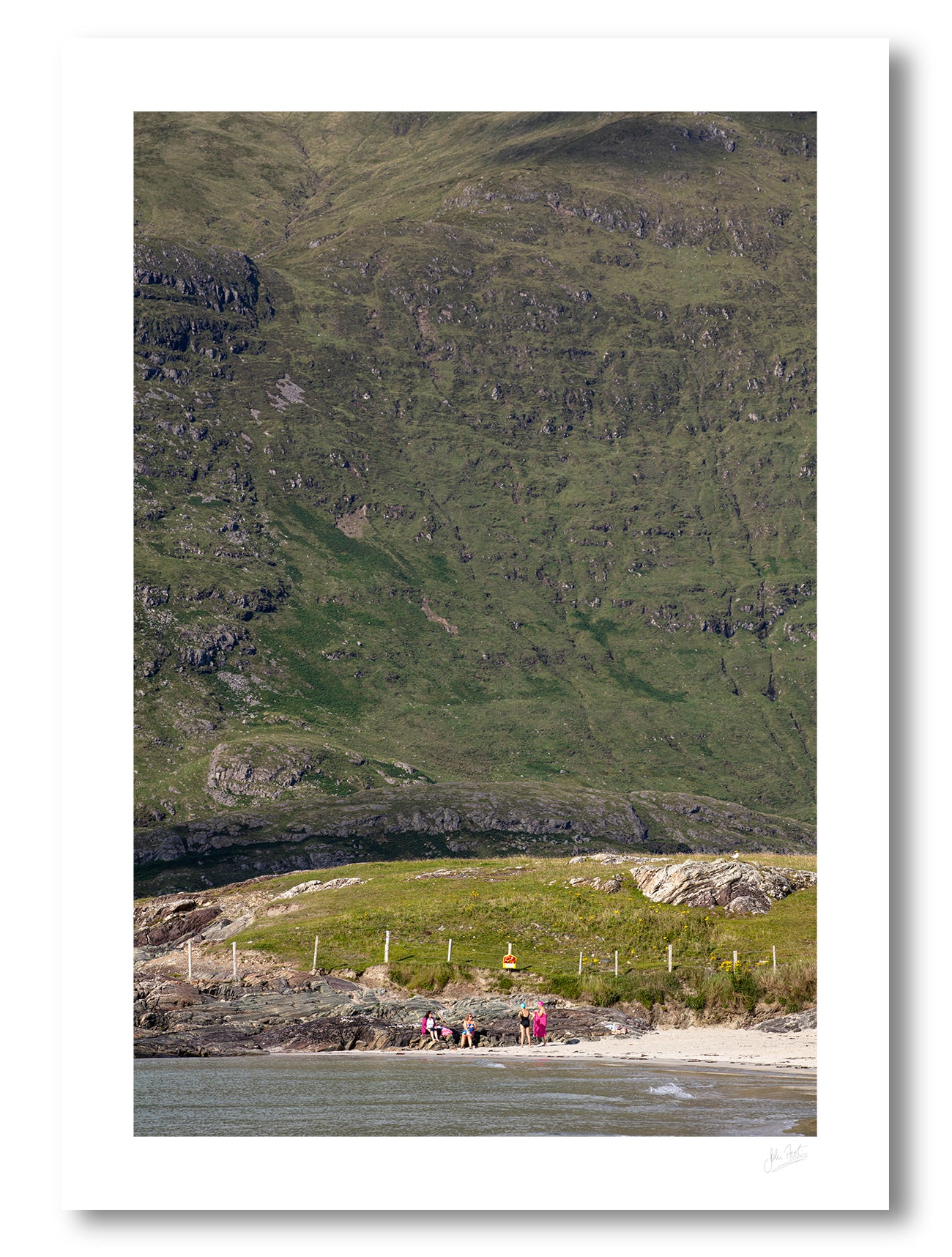 an unframed fine art photographic print of friends catching up on a lovely summer afternoon on Glassilaun Beach, Connemara, Ireland with the large Mweelrea mountain as the background, available to buy online