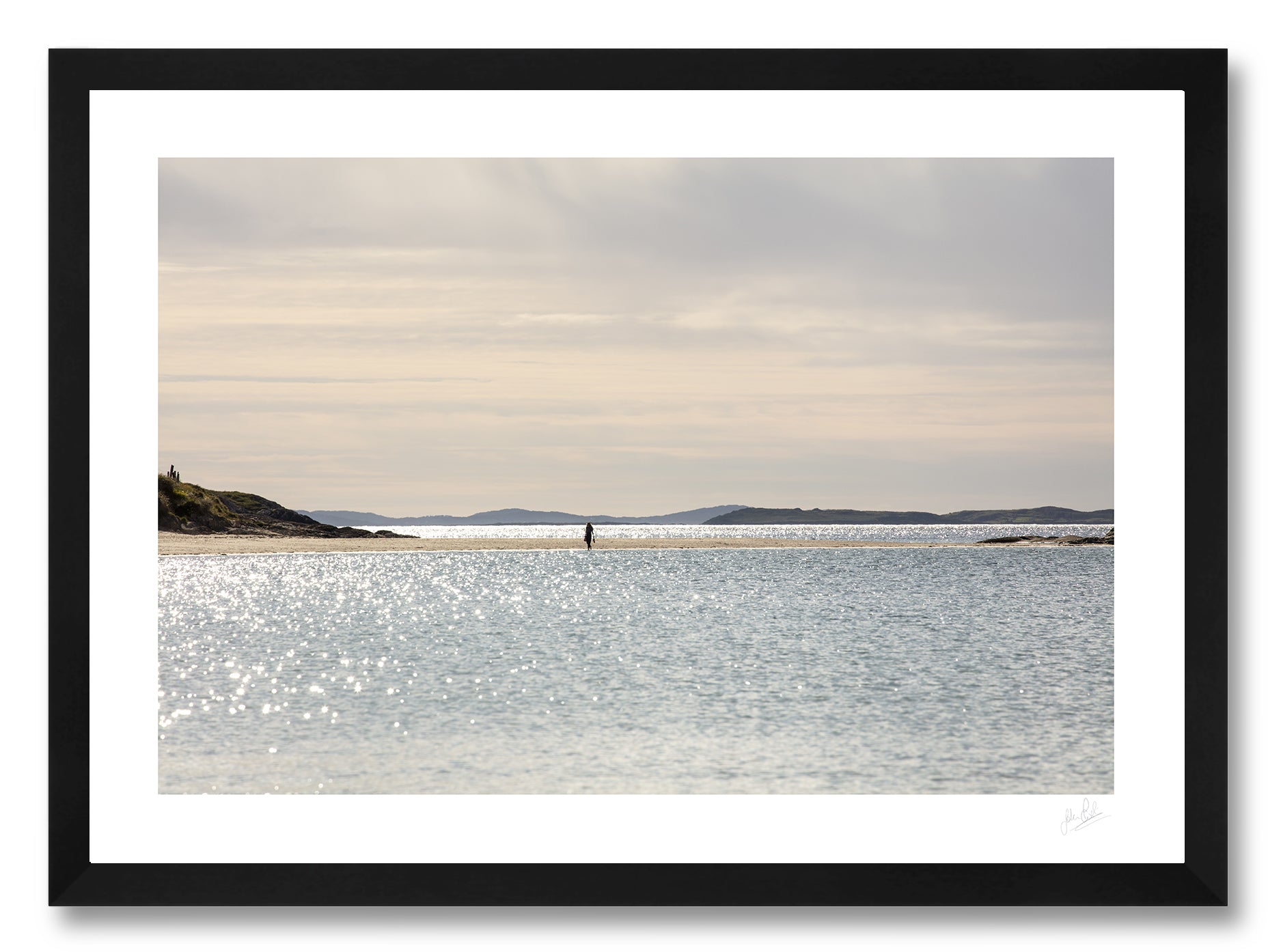 a framed fine art photographic print of a young woman taking a leisurely stroll along a quiet Glassilaun Beach in Connemara, Ireland on a beautiful summer afternoon, available to buy online