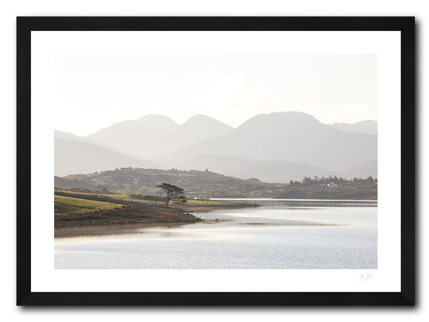 a framed fine art photographic print looking across Ballynakill Lough, Connemara to the 12 Bens mountain range on a bright summer morning, available to buy online