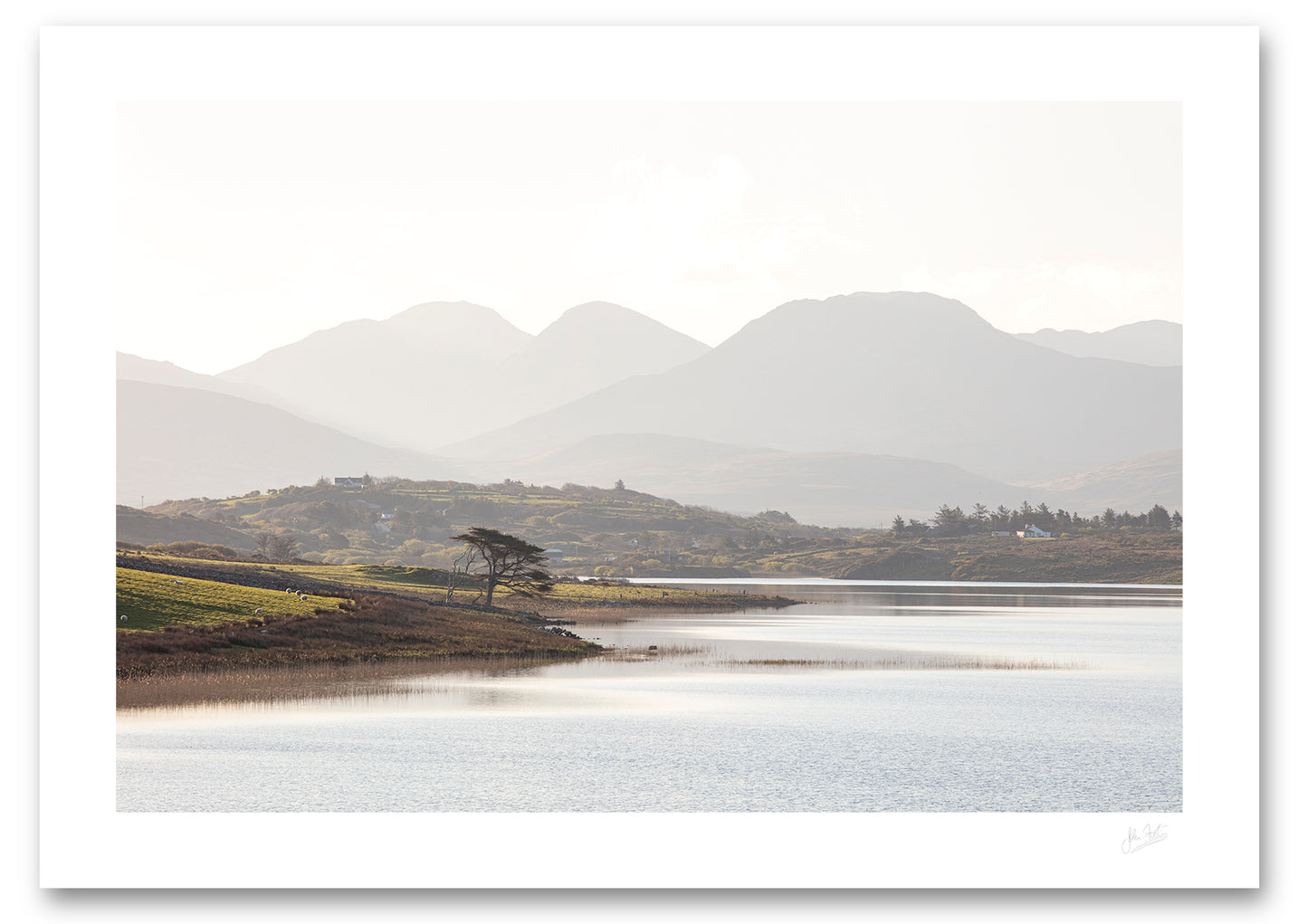 an unframed fine art photographic print looking across Ballynakill Lough, Connemara to the 12 Bens mountain range on a bright summer morning, available to buy online