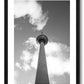 framed print of Berlin's TV tower from below touching the clouds in the sky