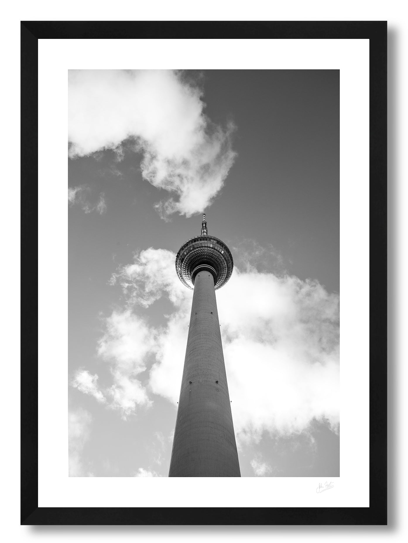 framed print of Berlin's TV tower from below touching the clouds in the sky