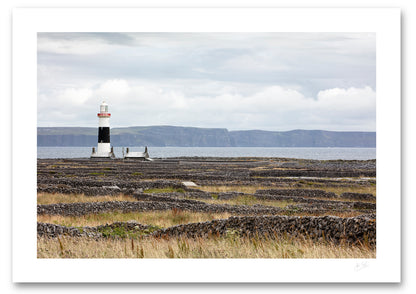 an unframed fine art photographic print of Inisheer Island's famous dry stone walls surrounding the lighthouse while the Cliffs of Moher are visible in the background, available to buy online